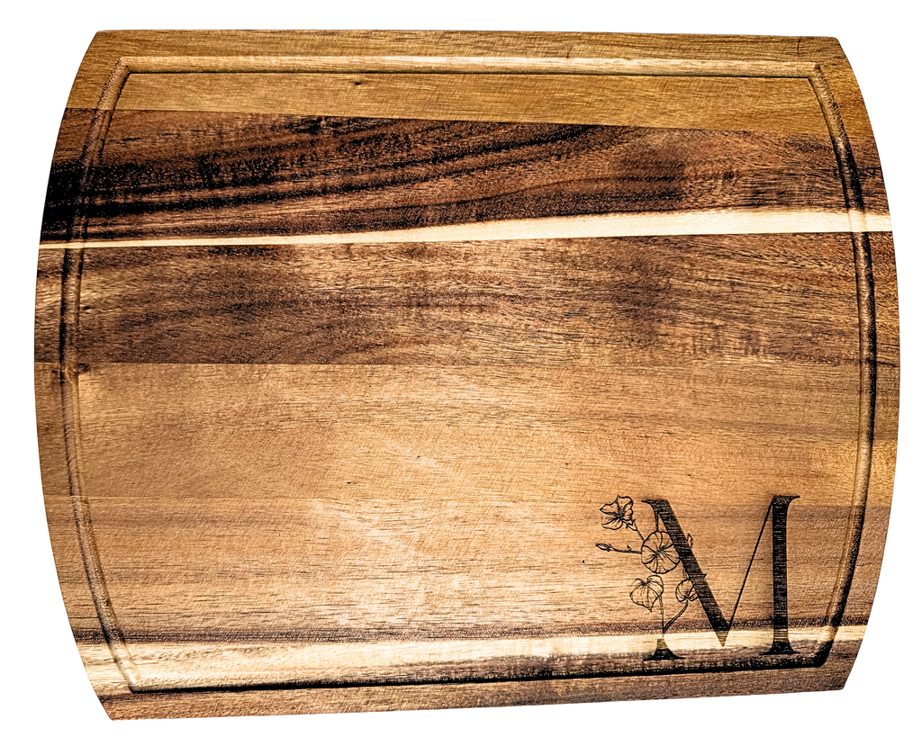 Wooden cutting board with a engraved design on a white background