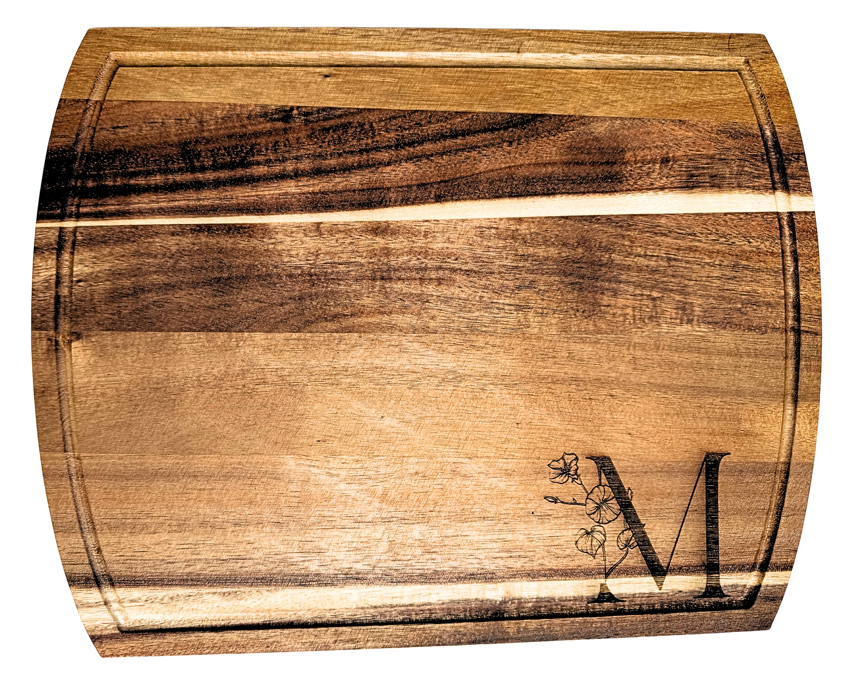 Wooden cutting board with a engraved design on a white background